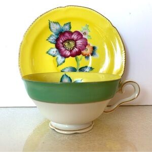 VTG WALES TEA CUP AND SAUCER HAND PAINTED YELLOW WITH FLOWER
